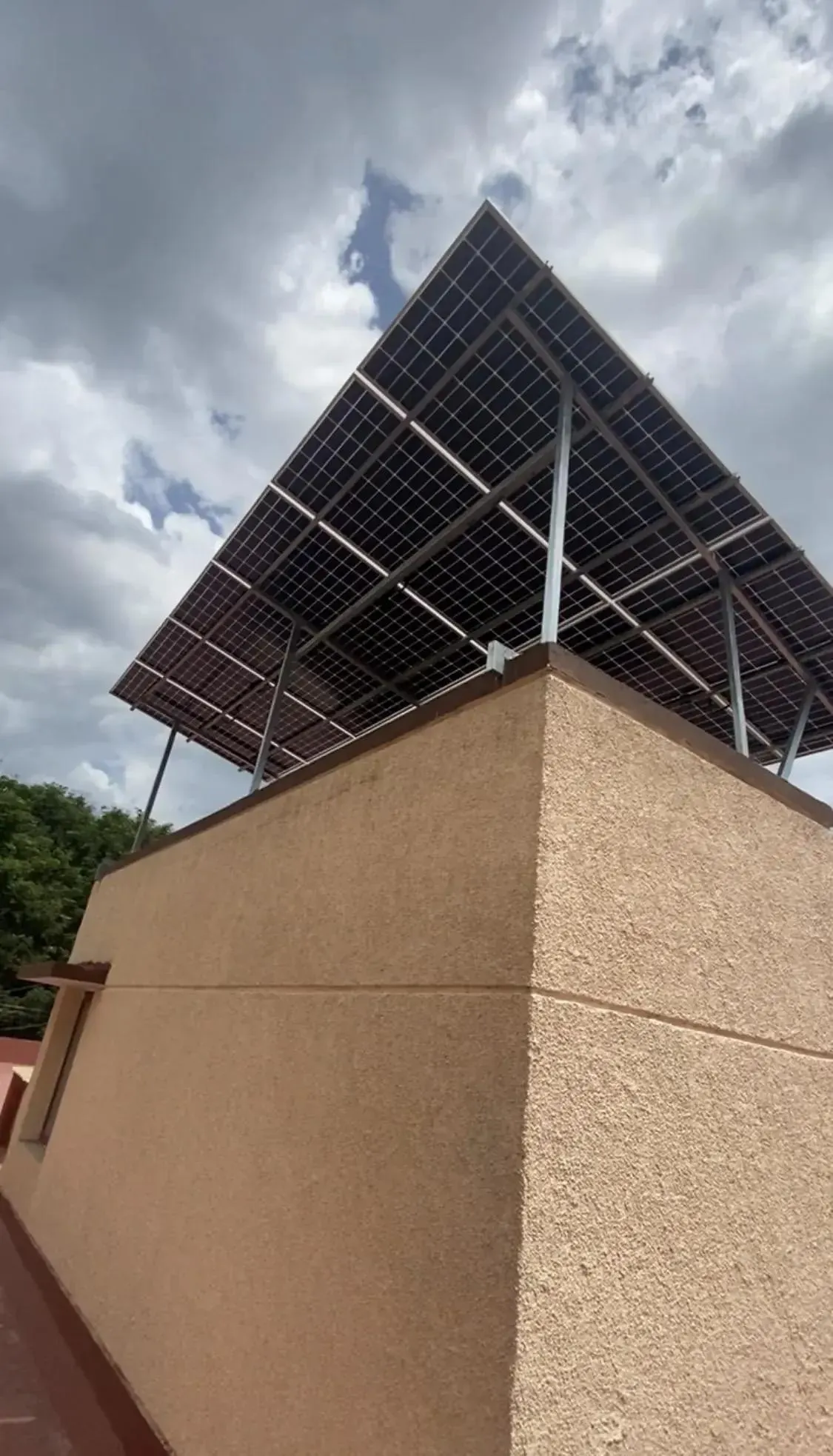 Custom cantilever solar array installed above a rooftop headroom in Kellys, Chennai
