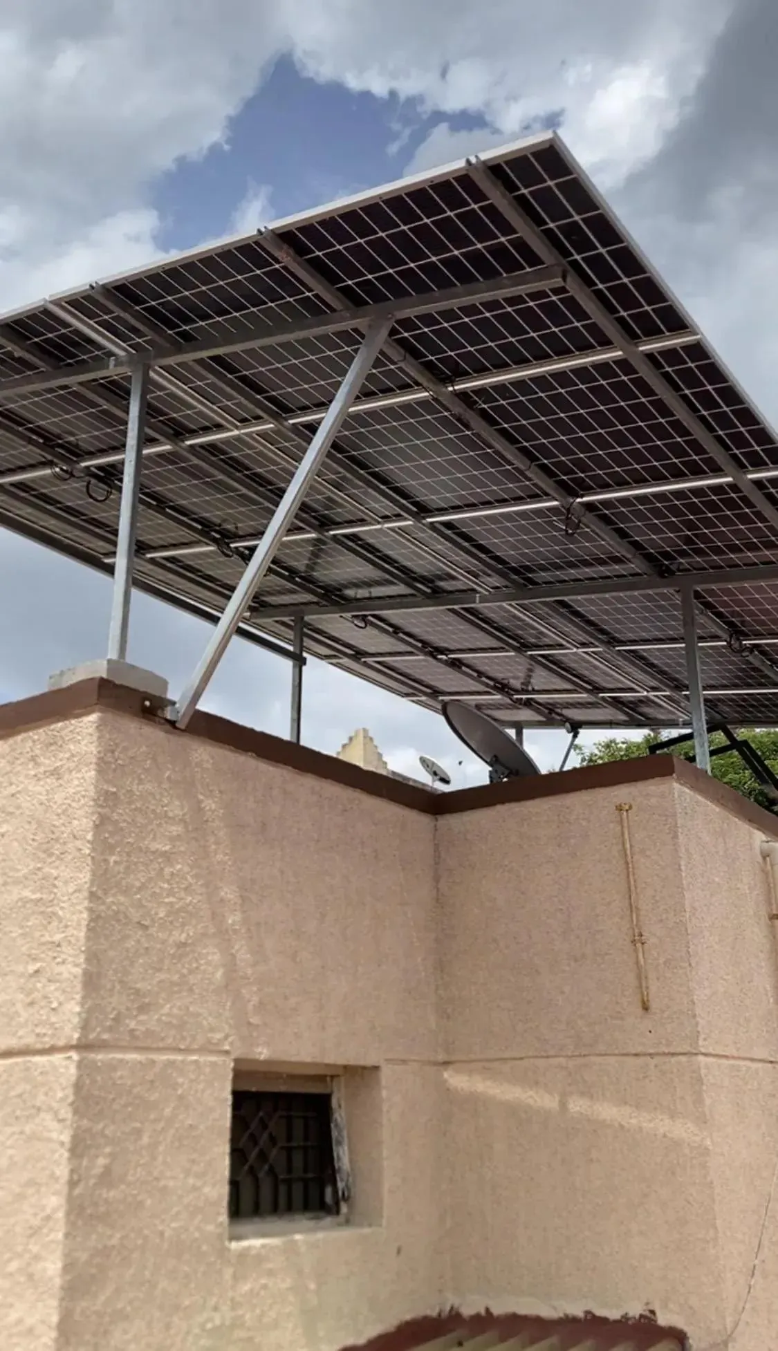 Custom cantilever solar structure installed above a rooftop headroom in Kellys, Chennai